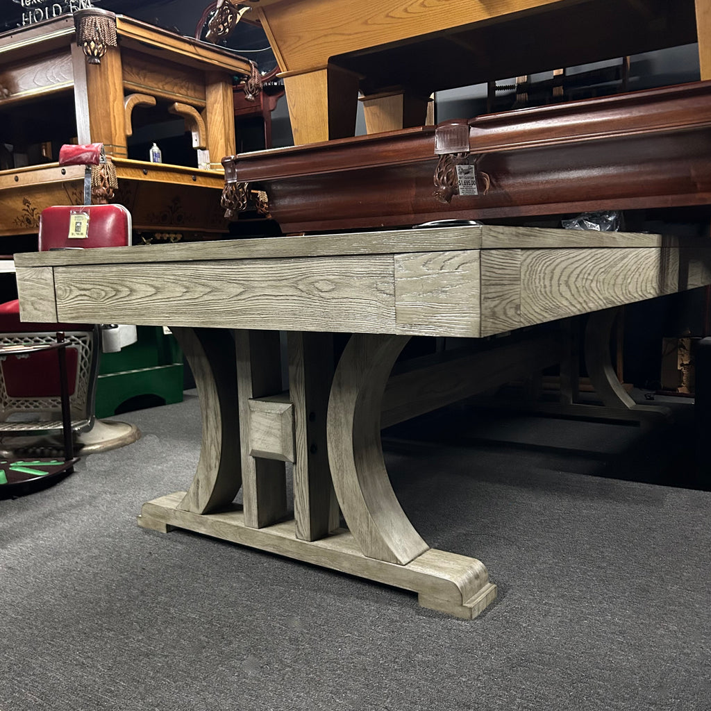 Silver pool table with curved base features