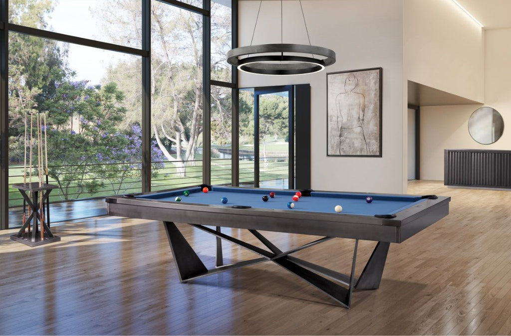 essex pool table with geometric bade in room with windows and blue felt