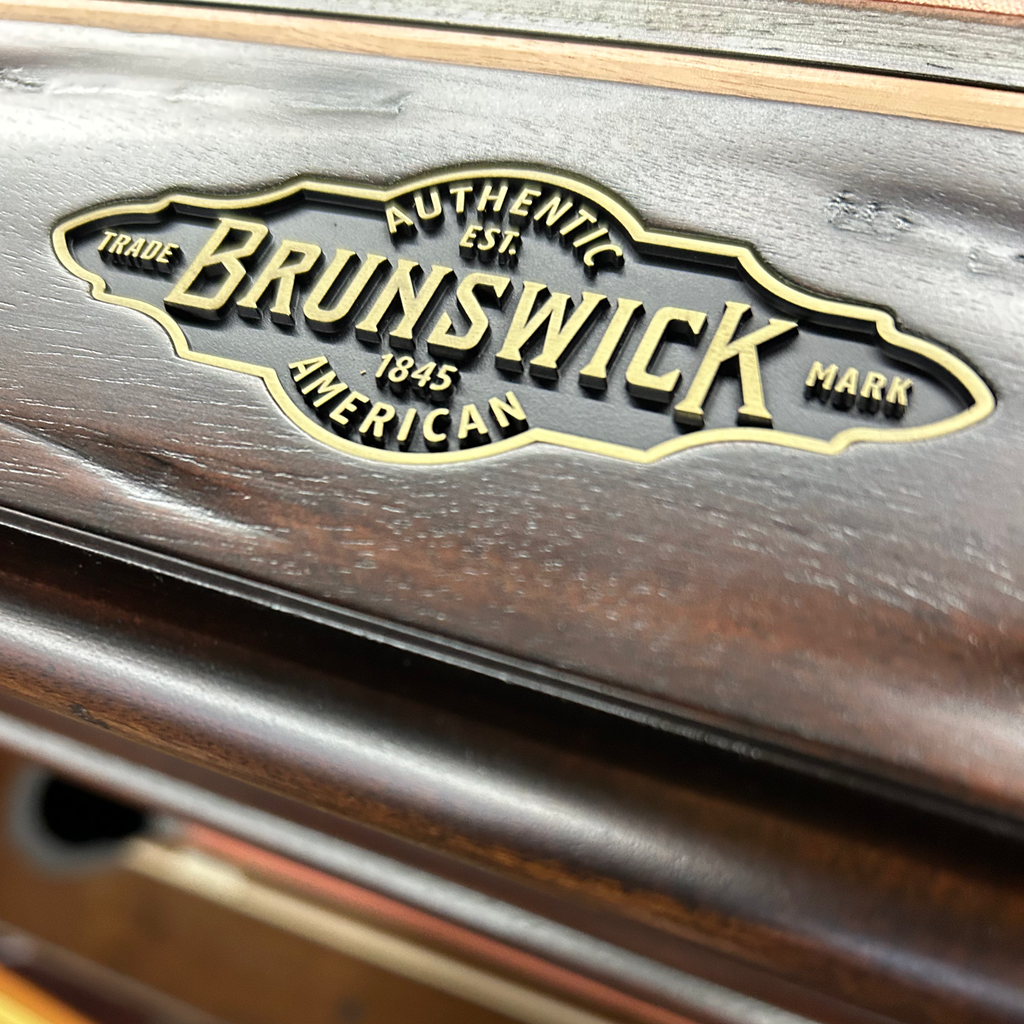 Closeup of brunswick name plate on end rail