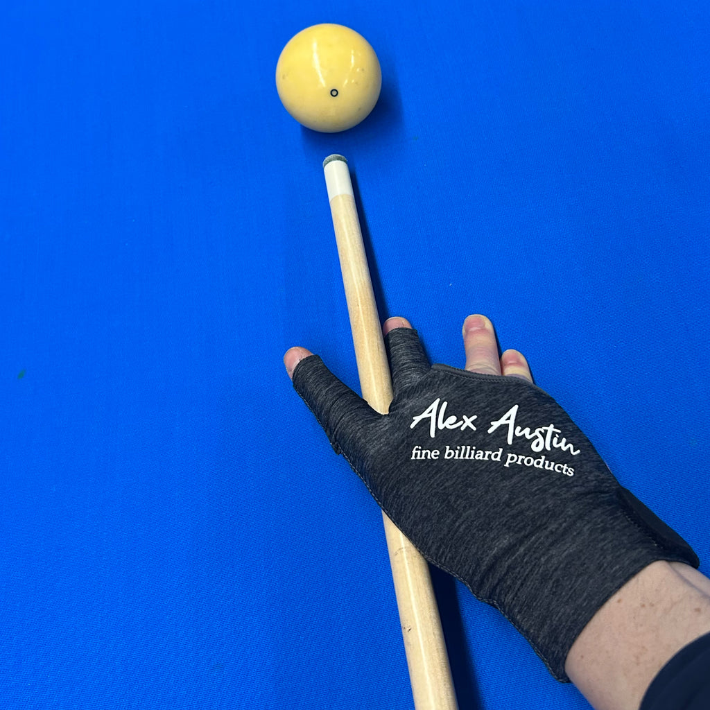 heather grey and black three fingered right handed pool glove on pool table with blue felt