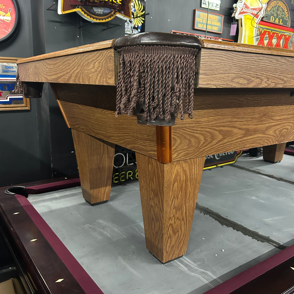 8ft imperial pool table with brown fringe pocket and tapered leg corner view