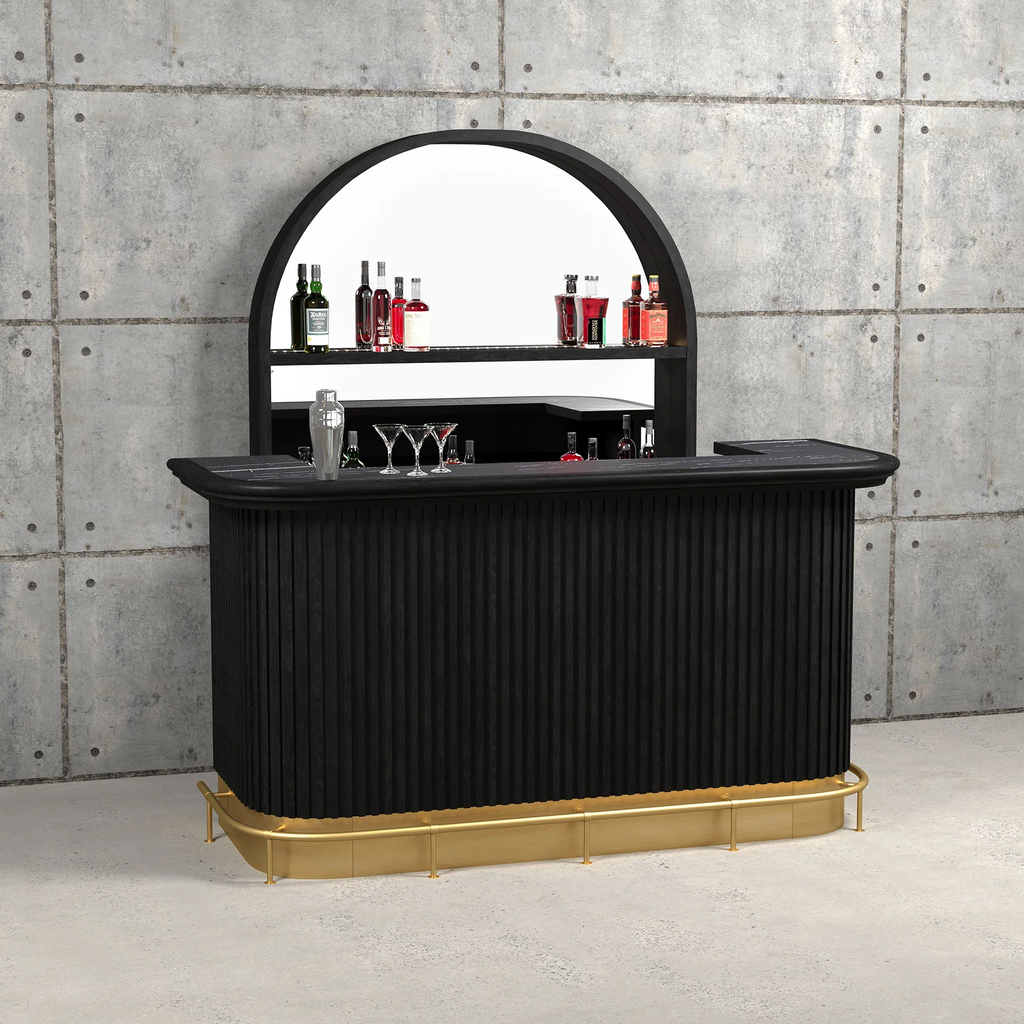 Concrete wall and black bar with brass foot and cocktail shaker