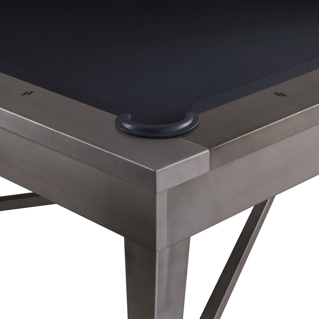 Corner view of metal table and leather rim of pocket