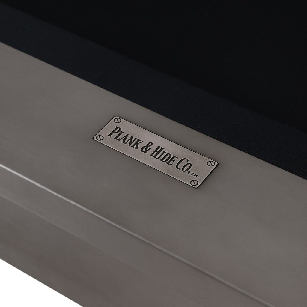Plaque on end rail with black cloth and plank and hide logo