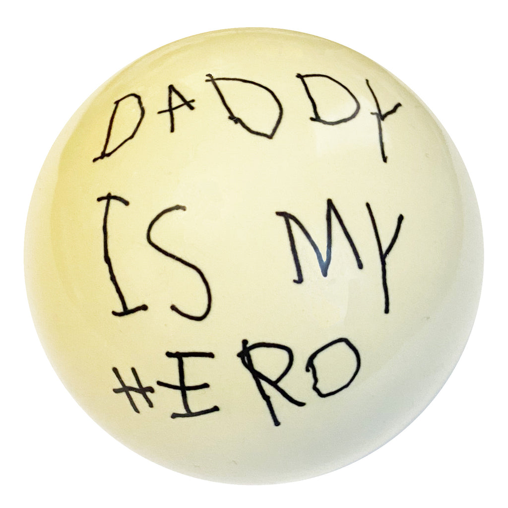 Cue Ball with Daddy is My Hero written on it