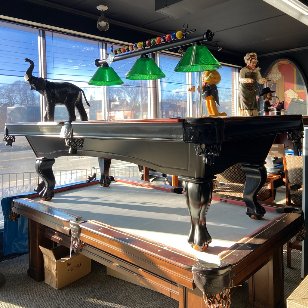 Riley Pool Table shown in store with light over it
